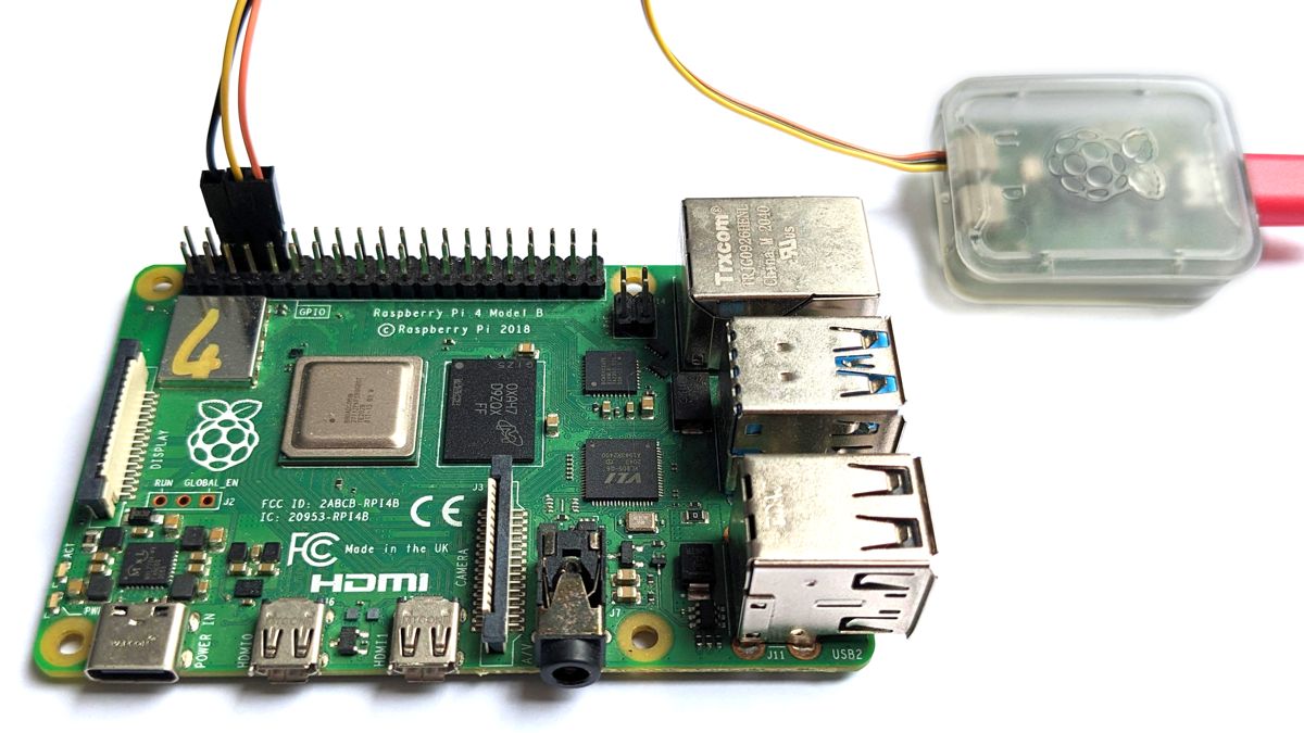 A close-up of the Raspberry Pi debug probe connected to the UART on the GPIO header of a Raspberry Pi 4B